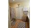 Well-organized bathroom with a shower, linen closet, and laminate flooring at 7186 Cressida Ct, Las Vegas, NV 89113