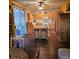 Traditional kitchen with an island, wood cabinets and dark wood flooring at 7186 Cressida Ct, Las Vegas, NV 89113