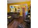 Cozy living room showcasing an open layout with dark laminate floors at 7186 Cressida Ct, Las Vegas, NV 89113