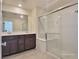 Bright Primary bathroom with double sinks and glass shower at 7246 Copper Grove Ave, Las Vegas, NV 89113