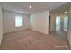 Large bedroom featuring neutral carpet and a view of the corridor at 7246 Copper Grove Ave, Las Vegas, NV 89113