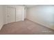 Bedroom featuring neutral carpet and a spacious closet at 7246 Copper Grove Ave, Las Vegas, NV 89113