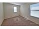 Bedroom featuring neutral carpet and a view of the front yard at 7246 Copper Grove Ave, Las Vegas, NV 89113