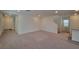 Spacious living room featuring neutral carpet, recessed lighting and white walls at 7246 Copper Grove Ave, Las Vegas, NV 89113