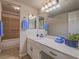 Bathroom featuring a vanity, large mirror, tiled shower and flooring at 725 N Royal Crest Cir # 213, Las Vegas, NV 89169