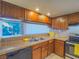 Functional kitchen offers tile countertops, stainless steel appliances, and a double sink at 725 N Royal Crest Cir # 213, Las Vegas, NV 89169