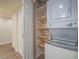 A laundry space featuring washer, dryer, and shelving for storage at 725 N Royal Crest Cir # 213, Las Vegas, NV 89169