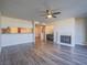 A spacious living room with hardwood floors, a fireplace, and an open layout at 725 N Royal Crest Cir # 213, Las Vegas, NV 89169