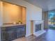 Living area showcases a fireplace, built-in bar, and sliding glass doors to balcony at 725 N Royal Crest Cir # 213, Las Vegas, NV 89169