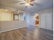 Open-concept living room with hardwood floors, washer/dryer, and easy access to kitchen at 725 N Royal Crest Cir # 213, Las Vegas, NV 89169