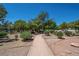 Picturesque walking path through lush gardens and landscaping, perfect for a peaceful stroll outdoors at 725 N Royal Crest Cir # 213, Las Vegas, NV 89169