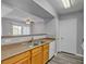 Bright kitchen featuring stainless steel sink, wood counter tops, and a view to the living space at 7255 W Sunset Rd # 2007, Las Vegas, NV 89113