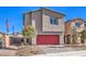 Contemporary two-story home with a red garage door, desert landscaping, and blue sky at 804 Ruby Sedona Ave # Lot 152, North Las Vegas, NV 89081