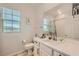 Bright bathroom showcasing a white sink vanity, modern fixtures, and a window for natural light at 8125 Skye Vineyard Dr, Las Vegas, NV 89166