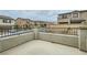 A concrete balcony with black metal guard rails overlooking neighboring houses and the community at 8125 Skye Vineyard Dr, Las Vegas, NV 89166