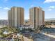 An aerial view of the luxury high-rise with a resort-style pool, landscaping and surrounding city views at 8255 Las Vegas Blvd # 610, Las Vegas, NV 89123