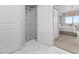 Elegant bathroom with a glass shower and access to the primary bedroom at 8255 Las Vegas Blvd # 610, Las Vegas, NV 89123