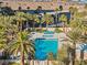 Aerial view of the pool area, showcasing palm trees, lounge seating and sparkling blue water, creating a resort-like ambiance at 8255 Las Vegas Blvd # 610, Las Vegas, NV 89123