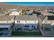 Aerial view of a home with a covered patio and outdoor dining area in the backyard at 9007 Antora Summit St, Las Vegas, NV 89166