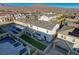 Aerial view of a home with a large backyard, including artificial turf and a covered patio at 9007 Antora Summit St, Las Vegas, NV 89166