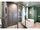 Stylish bathroom featuring a walk-in shower, modern fixtures, and a sleek soaking tub at 9007 Antora Summit St, Las Vegas, NV 89166