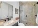 Modern bathroom featuring matte black hardware, glass-enclosed shower and beautiful finishes at 9007 Antora Summit St, Las Vegas, NV 89166