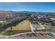 Aerial view of the community park featuring a playground, basketball court, and green space with walking paths at 9007 Antora Summit St, Las Vegas, NV 89166