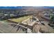 Aerial view of the community park featuring a playground, basketball court, and lush green space for outdoor activities at 9007 Antora Summit St, Las Vegas, NV 89166