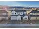 Beautiful new construction featuring a three-car garage, pristine landscaping and mountain views at 9007 Antora Summit St, Las Vegas, NV 89166