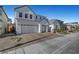 Bright two-story home featuring a three-car garage and stone landscaping at 9007 Antora Summit St, Las Vegas, NV 89166