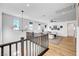 Second floor living area with wood floors, neutral decor, and lots of natural light at 9007 Antora Summit St, Las Vegas, NV 89166