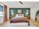 Inviting main bedroom featuring a ceiling fan, hardwood floors, and stylish decor, creating a serene retreat at 9007 Antora Summit St, Las Vegas, NV 89166