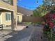 Well maintained backyard featuring a fire pit, colorful bougainvillea, and an entertainment space at 945 Pomander Point Pl, Henderson, NV 89012