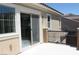 A balcony with beige stucco includes sliding glass door and a black metal railing at 945 Pomander Point Pl, Henderson, NV 89012