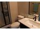 Bathroom with a glass-enclosed shower, modern vanity, and a decorative 'RELAX' sign at 945 Pomander Point Pl, Henderson, NV 89012