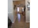 An entryway features wood-look tile floors, neutral walls and a staircase at 945 Pomander Point Pl, Henderson, NV 89012