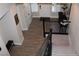 An entryway features wood-look tile floors, neutral walls and a staircase at 945 Pomander Point Pl, Henderson, NV 89012