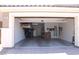 Spacious two-car garage with ample storage space, including overhead racks and shelving at 945 Pomander Point Pl, Henderson, NV 89012