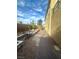 A narrow side yard has a paved path and desert landscaping, offering a low-maintenance outdoor space at 945 Pomander Point Pl, Henderson, NV 89012