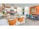 Contemporary kitchen featuring a breakfast bar, sleek countertops, stainless steel appliances, and adjacent dining area at , North Las Vegas, NV 89084