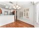 Open-concept dining area offering hardwood floors, natural light, and a view of the kitchen at 10029 Netherton Dr, Las Vegas, NV 89134