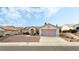 A charming, one-story home featuring desert landscaping, a circular entryway, and a two-car garage at 10029 Netherton Dr, Las Vegas, NV 89134