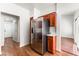 Spacious kitchen area featuring stainless steel refrigerator, wooden cabinets, and sleek flooring at 10029 Netherton Dr, Las Vegas, NV 89134