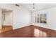 Bright living room featuring dark laminate flooring, and plantation shutters at 10029 Netherton Dr, Las Vegas, NV 89134