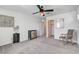 Bright bedroom featuring a ceiling fan, neutral walls, and carpet flooring at 10699 Sariah Skye Ave, Las Vegas, NV 89166