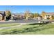 Gated community entrance with mountain views and well-manicured green spaces at 10699 Sariah Skye Ave, Las Vegas, NV 89166