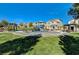 Community playground with climbing structures and shaded picnic areas on a sunny day at 10699 Sariah Skye Ave, Las Vegas, NV 89166