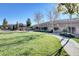 Community playground featuring seating and play structures surrounded by green grass at 10699 Sariah Skye Ave, Las Vegas, NV 89166