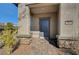 Close-up of the home's entrance with stone accents, covered porch, and a well-maintained brick walkway at 10699 Sariah Skye Ave, Las Vegas, NV 89166