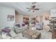 Open concept living room showcases the connection to the kitchen and second-floor access at 10699 Sariah Skye Ave, Las Vegas, NV 89166